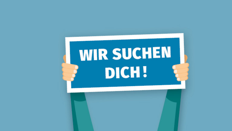 Eine Person hält Zettel mit der Aufschrift wir suchen dich Hoch